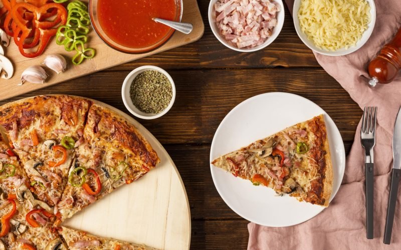 top-view-pizza-with-red-pepper-slice-plate